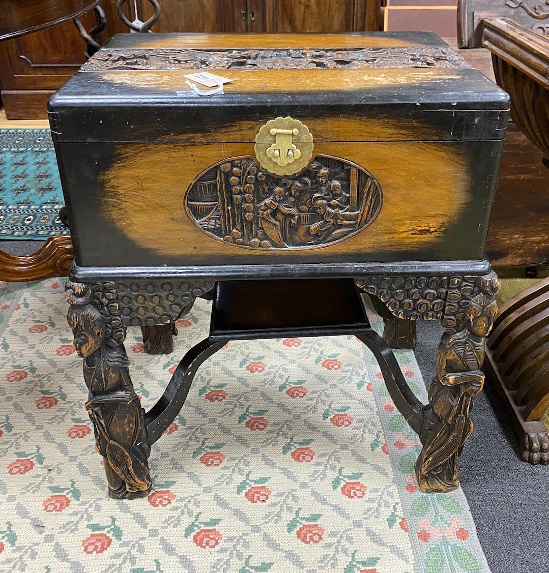 A Chinese carved camphorwood work box, width 60cm, depth 46cm, height 67cm